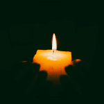 Candle in darkness